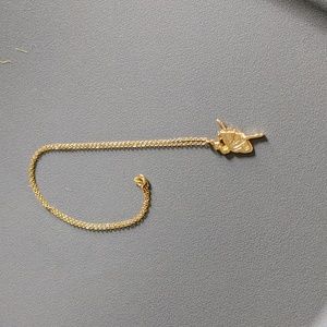 Gold ballerina necklace